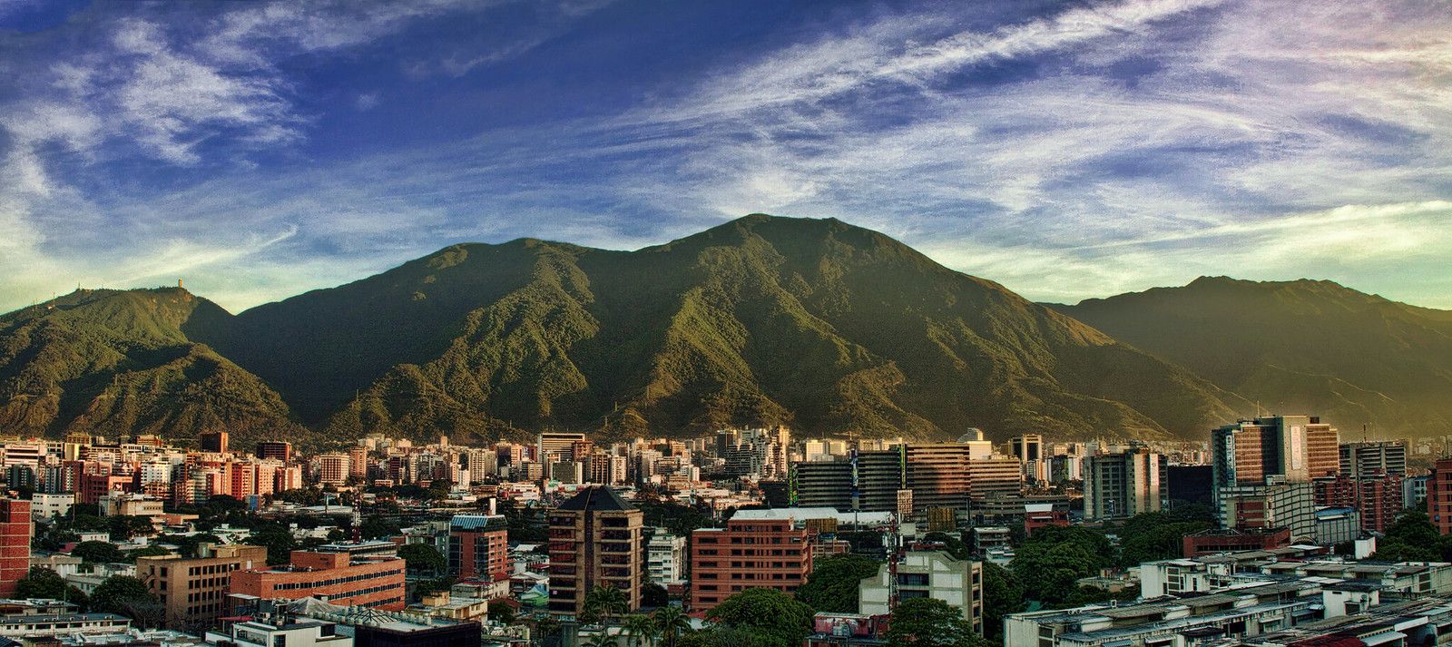 Panoramic view of Caracas beneath the El Ávila mountain range